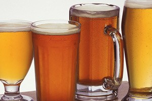 Photo of assorted mugs and glasses of beer.